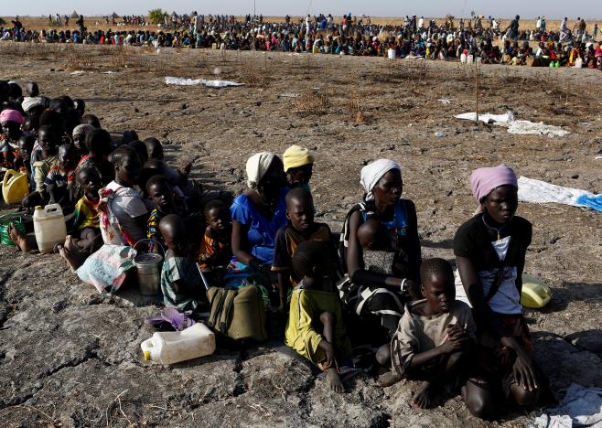 Women and children wait to be registered prior to a food distribution carried out by the United Nations World Food Programme (WFP) in Thonyor, Leer state, South Sudan, February 26, 2017. REUTERS/Siegfried Modola
